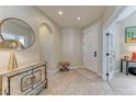 Inviting entryway with decorative accents and tile flooring at 9274 Viaggio Way, Highlands Ranch, CO 80126