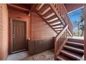 Exterior view of condo's front door and wooden stairway at 1931 Centennial Dr # 1931, Louisville, CO 80027