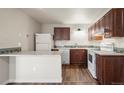 Kitchen with stainless steel appliances, tiled backsplash, and wood cabinets at 1931 Centennial Dr # 1931, Louisville, CO 80027