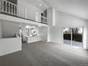Bright living room featuring high ceilings and access to the backyard at 4578 Malta St, Denver, CO 80249