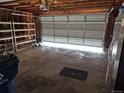 Spacious two-car garage with shelving and white door at 5171 S Quintero St, Centennial, CO 80015