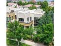 Modern exterior with a flat roof, many windows and lush landscaping at 8041 E 29Th Ave, Denver, CO 80238