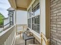 Cozy porch seating area offers a relaxing outdoor space with natural light and neighborhood views at 16181 White Hawk Dr, Parker, CO 80134