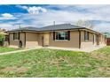 Lovely single-story home with a brick facade and well-maintained landscaping at 710 4Th St, Bennett, CO 80102