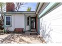 This inviting home shows the entryway, a convenient bench and a well-maintained two-car garage at 772 Ivywood Ct, Highlands Ranch, CO 80126