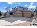 Attractive home showcasing a wide driveway and neat landscaping, ideal for comfortable suburban living at 6374 Arapahoe Ct, Parker, CO 80134