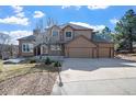 Lovely two-story house with a large driveway and a picturesque front yard, perfect for Gathering living at 6374 Arapahoe Ct, Parker, CO 80134