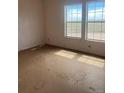 Bright room features a double-window that offers a view of the open land outdoors at 5500 Dacono Ct, Byers, CO 80103