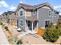 Charming townhome with muted siding, a small front porch, and low-maintenance landscaping at 17616 Bluetrail Ave, Parker, CO 80134