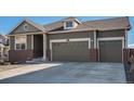 Charming two-story home featuring a three-car garage, brick accents, and well-maintained landscaping at 2906 E 163Rd Ave, Thornton, CO 80602