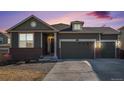 Charming two-story home featuring a three-car garage, brick accents, and well-maintained landscaping at 2906 E 163Rd Ave, Thornton, CO 80602