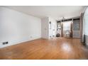 Spacious living room with hardwood floors, built-in shelves, and natural light at 390 Yates St, Denver, CO 80219