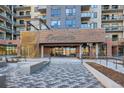 Beautiful entrance to an apartment complex with brick and stone, enhanced by modern architectural design at 20 Wilcox St # 316, Castle Rock, CO 80104