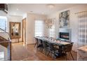 Elegant dining area with hardwood floors, a large table, and modern chandelier at 402 Garfield St, Denver, CO 80206