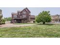 Expansive backyard with a multi-level deck, perfect for outdoor entertaining and enjoying the serene surroundings at 12745 Uinta St, Brighton, CO 80602