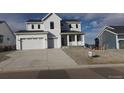 Charming two-story home features a spacious two car garage, clean landscaping, and a modern farmhouse design at 1153 Elbridge Dr, Elizabeth, CO 80107