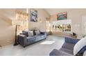Comfortable living room with stylish furniture, bright decor, and large windows filling the space with natural light at 20414 E 55Th Pl, Denver, CO 80249