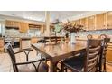 Kitchen/dining area with a view of wooden cabinets and stainless steel appliances at 33 L Rd, Golden, CO 80403