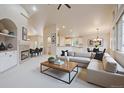 Open-concept living area with modern furnishings and seamless flow to the dining area at 3845 Miller St, Wheat Ridge, CO 80033