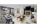 Bright living room featuring a fireplace, hardwood floors, and access to office space at 34 Benthaven Pl, Boulder, CO 80305