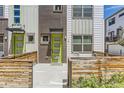 Charming front entrance with a vibrant green door and decorative wooden fencing at 4100 E Iliff Ave # 4, Denver, CO 80222