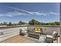 Relaxing rooftop deck featuring stylish outdoor seating, modern decor, and panoramic views at 4100 E Iliff Ave # 4, Denver, CO 80222