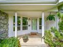 Inviting front porch with decorative columns and large windows, adding to the home's curb appeal at 461 Nome St, Aurora, CO 80010