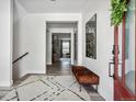 Bright entryway features wood floors, bench seating and decorative accents at 11053 Bright Sky Cir, Littleton, CO 80125