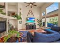Bright living room with hardwood floors, high ceilings, expansive windows, and modern decor at 6699 S Robb St, Littleton, CO 80127