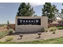 Terrain, Castle Rock, CO community entrance sign with manicured landscaping and blue skies at 1871 Water Birch Way, Castle Rock, CO 80108