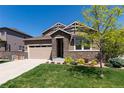 Charming single-Gathering home with a stone facade, manicured lawn, and an attached two-car garage at 16549 Prospect Ln, Broomfield, CO 80023