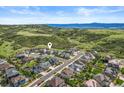 An aerial view of the community showing its location nestled in the hills with scenic mountain views at 1133 Lucky Ct, Castle Rock, CO 80109