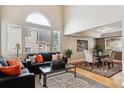 Open living and dining area with hardwood floors at 10985 W Dumbarton Cir, Littleton, CO 80127