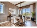 Stylish dining room featuring modern decor, large windows with bright light, and seating for six at 14115 Blue Stem St, Broomfield, CO 80020