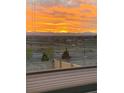 Scenic view from the property overlooking distant mountains during a vibrant sunrise or sunset at 12841 Galapago St, Westminster, CO 80234