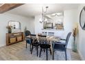 Dining area with natural light, wood floors, and access to the kitchen at 10335 E Peakview Ave # B, Englewood, CO 80111