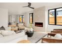 Bright living room with a modern fireplace and neutral decor at 2391 King St, Denver, CO 80211