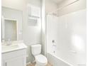 Clean bathroom featuring a bathtub and white vanity at 8905 Rifle St, Commerce City, CO 80022