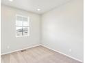 Bright bedroom with neutral walls and carpet flooring at 8905 Rifle St, Commerce City, CO 80022