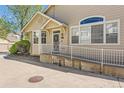 Close up exterior of home with ramp and well-maintained landscaping at 8843 W Phillips Dr, Littleton, CO 80128