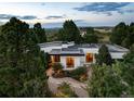 Overhead view of the home showing mature trees and landscaped front and back yards at 3823 Castle Butte, Castle Rock, CO 80109