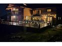 An amazing log home back deck complete with lights and plenty of room to entertain guests at 6241 Kilimanjaro Dr, Evergreen, CO 80439