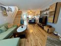 Inviting living room boasts hardwood floors, open floor plan and natural light throughout the space at 1732 S Blackhawk Way # D, Aurora, CO 80012