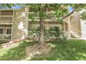 Charming condo complex with inviting balconies, lush greenery, and a welcoming atmosphere at 8225 Fairmount Dr # 102, Denver, CO 80247