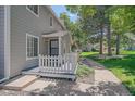 Charming home with a inviting porch and manicured lawn at 8438 Everett Way # B, Arvada, CO 80005