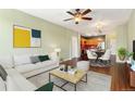 Open concept living room with hardwood floors, recessed lighting, and a comfortable seating area at 9633 E 5Th Ave # 10208, Denver, CO 80230
