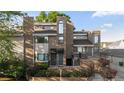 Inviting brick townhome featuring multi-level design with charming front garden, perfect for curb appeal at 221 S Garfield St # 213, Denver, CO 80209