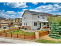Charming two-story home with a fenced yard, porch, and easy access to outdoors at 4808 S Picadilly Ct, Aurora, CO 80015