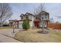 Charming home with well-manicured lawn, mature trees and three-car garage at 18292 E Caspian Pl, Aurora, CO 80013