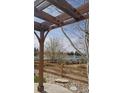 View from covered patio overlooking backyard, lake, and walking path at 18292 E Caspian Pl, Aurora, CO 80013